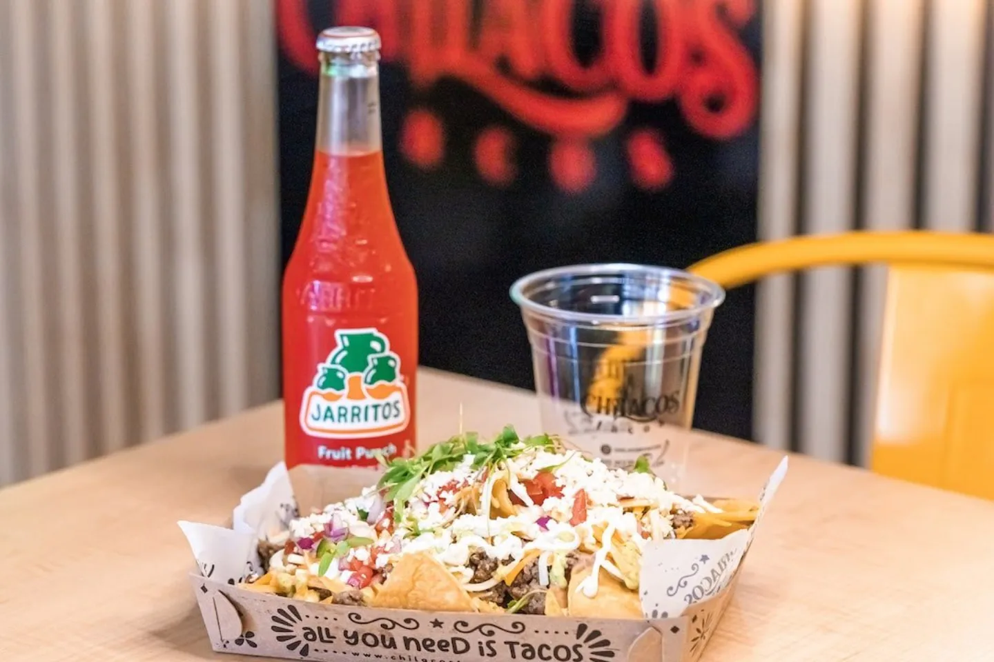 Chilacos nachos with a Jarritos soda